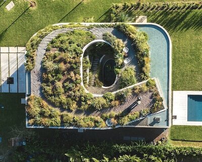 rooftop garden crowns concrete house in argentina shaped by spiraling patios