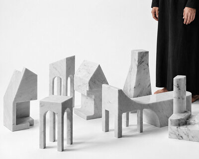 carved from solid carrara marble, abstract house-like objects explore architectural form