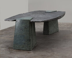 EWE studio’s sculptural table combines hand-carved green marble with cast aluminum