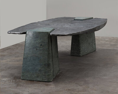 EWE studio’s sculptural table combines hand-carved green marble with cast aluminum