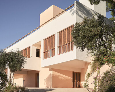 open patios and white geometric terraces extend casa blajot along catalan coast