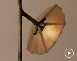 fiberglass shells and bronze skeletal forms shape sculptural light and furniture collection