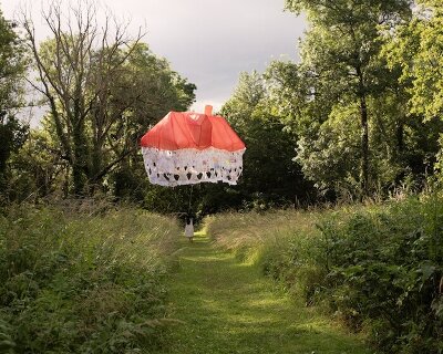 this floating house made from collective wishes forms a temporary architecture of dreams