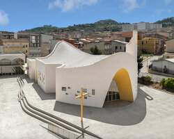 a flowing roof and fluid concrete walls frame the new santa barbara parish complex in sicily