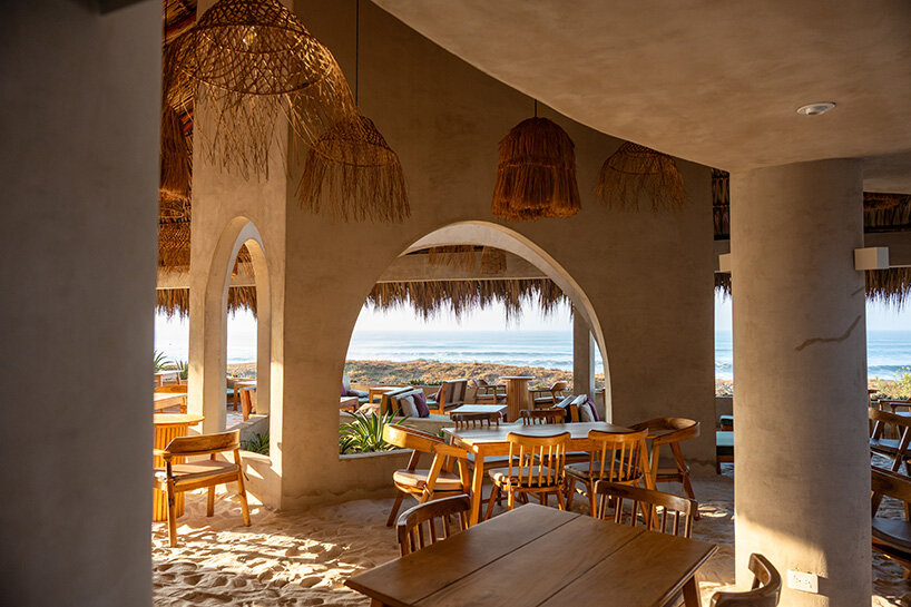 gris shapes naturally cooled beach club around series of open-air pavilions in guatemala - 11