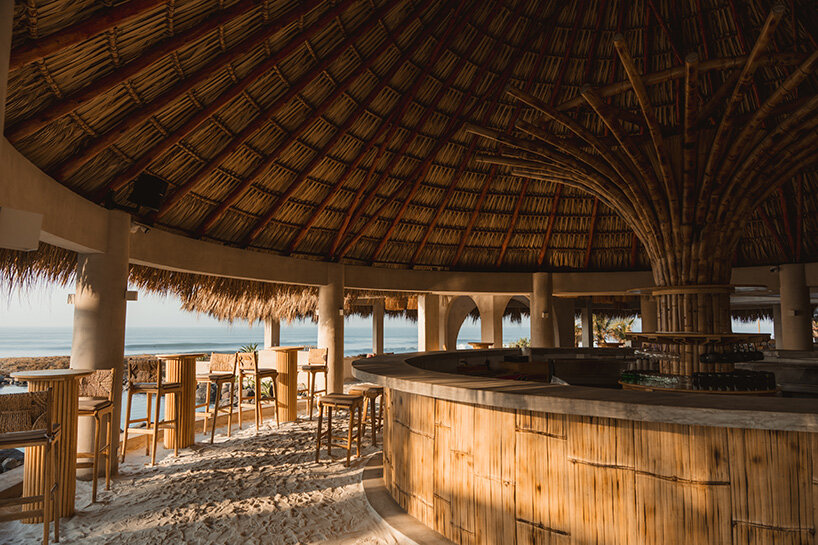 gris shapes naturally cooled beach club around series of open-air pavilions in guatemala - 8