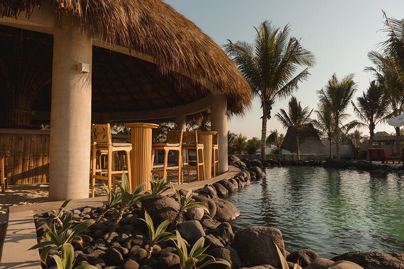 gris shapes naturally cooled beach club around series of open-air pavilions in guatemala - 5