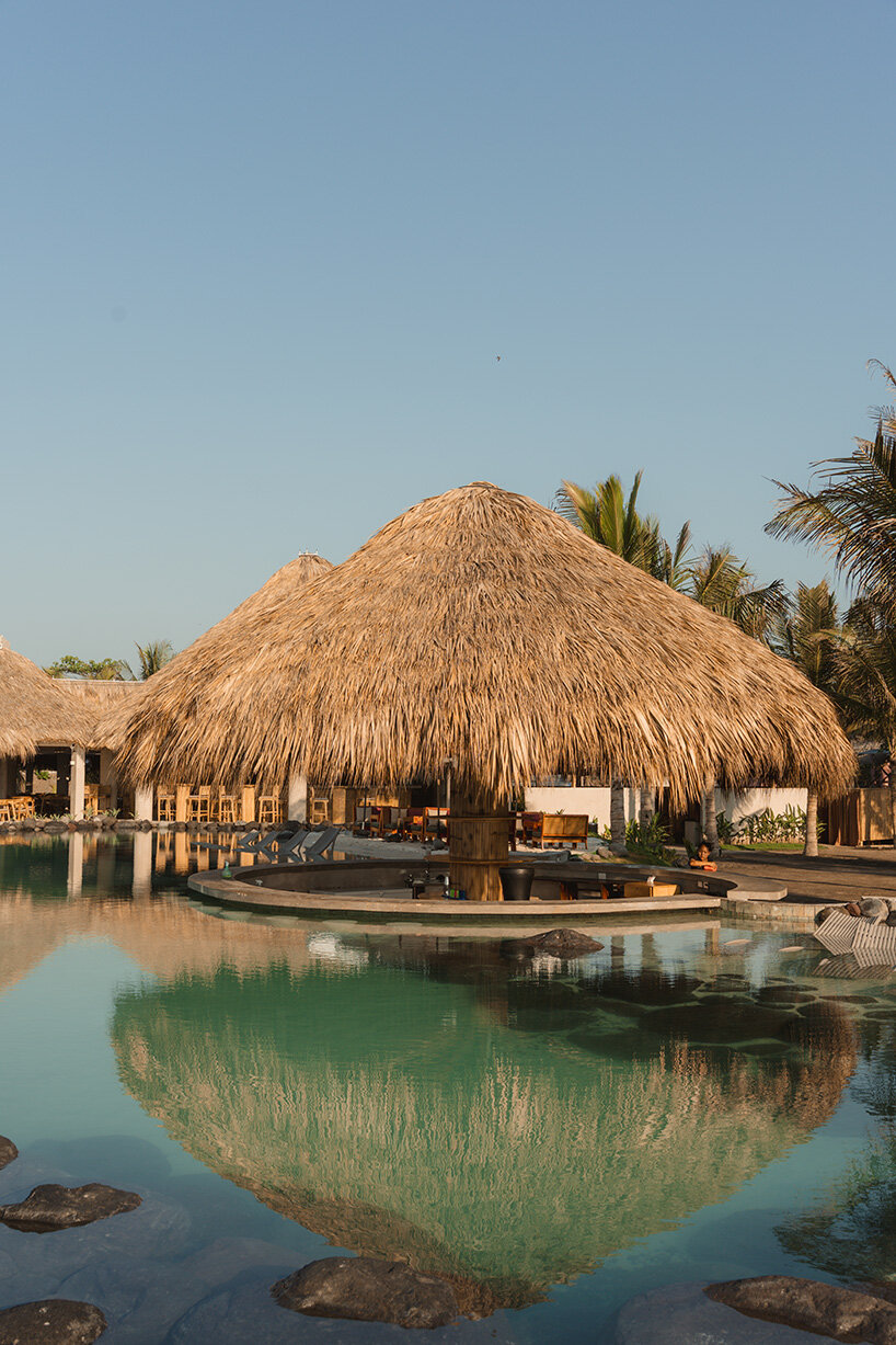 gris shapes naturally cooled beach club around series of open-air pavilions in guatemala - 4