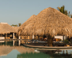gris shapes naturally cooled beach club around series of open-air pavilions in guatemala