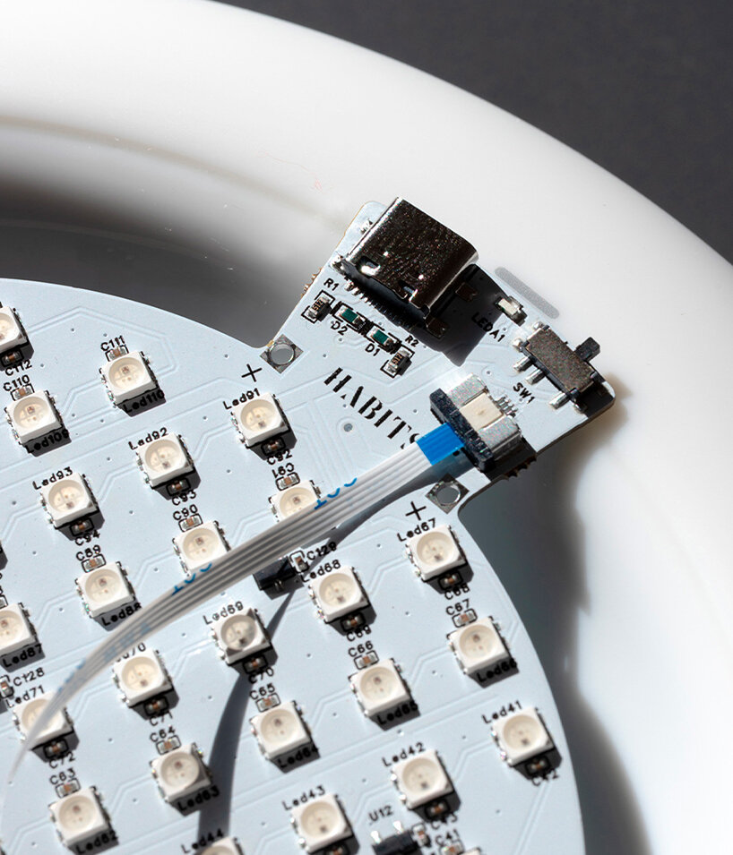 habits design transforms dining into a synchronized light performance - 8