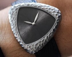 this hand-chiseled watch takes cues from ancient stone tools collected by brâncuși