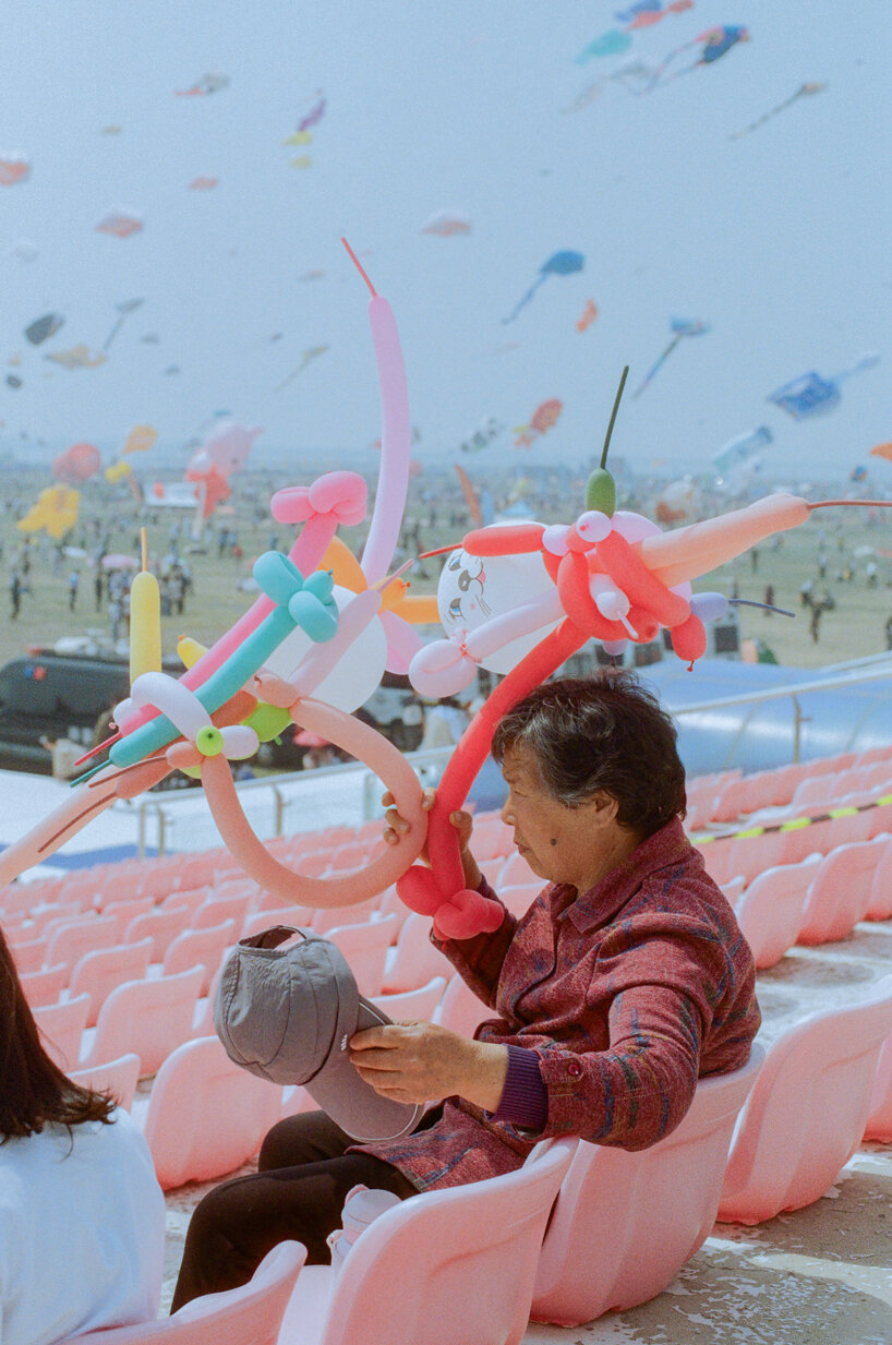 beneath a kite-filled sky in china, janice chan photographs tropical fish and noodle packets - 1