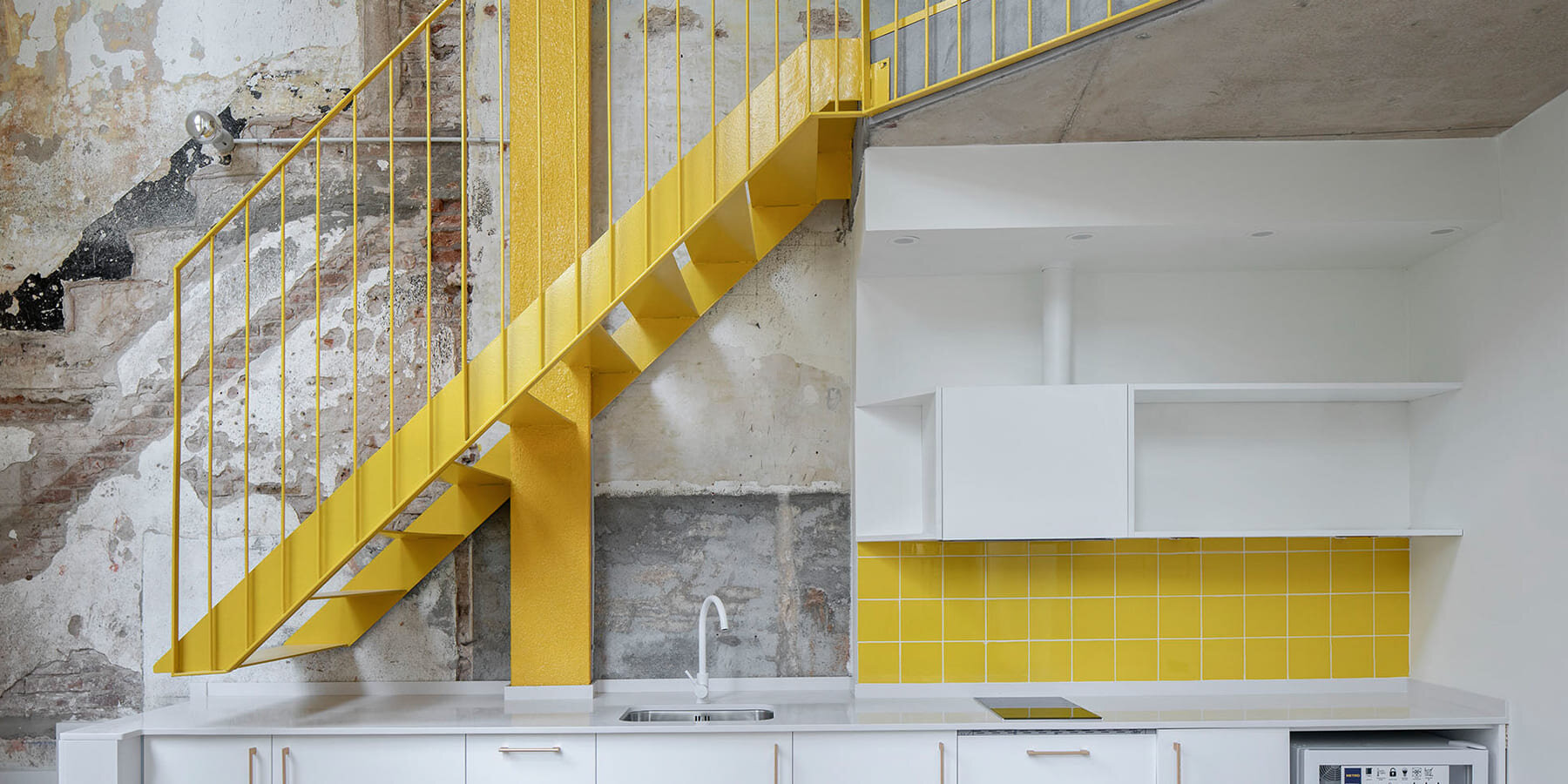 l-hospitalet-de-llobregat-marti-julia-m-i-r-a-rehabilitation-corner-building-apart-hotel-yellow-designboom-1800-3