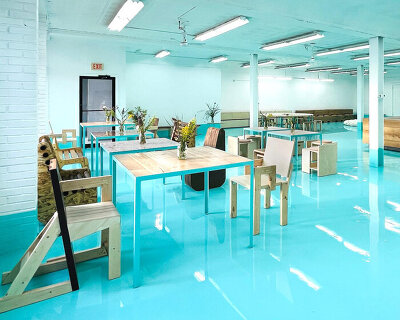 reclaimed oak, cork, and cardboard build flexible furniture for cultural hub in NY