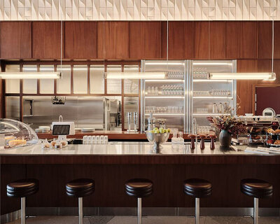 modernist-inspired café framed by layered wood and steel extends almaty museum of arts