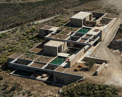 MOLD architects sinks five stone retreats into the rocky slopes of serifos island