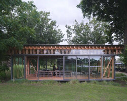 rhythmic timber and glass pavilion unfolds beneath pecan tree canopy in argentina