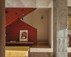 red microcement pairs with onyx marble to reframe brutalist barcelona duplex