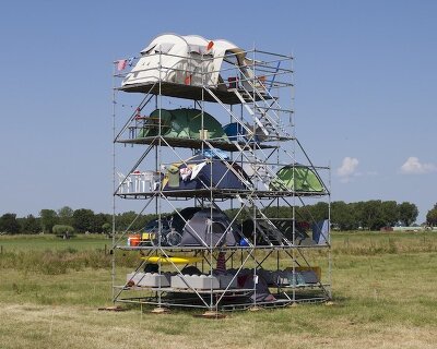 willem de haan stacks 12 tents vertically to question density and the way we occupy space