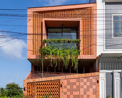 perforated terracotta screens cool NAQ architecture’s breezy vĩnh long house