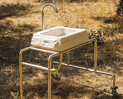 konstantinos gournas turns reclaimed marble sink into a mobile wash station