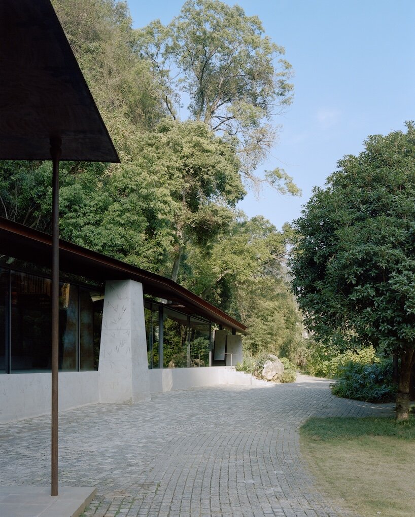 atelier guo frames yangshuo’s mountain landscape beneath a sweeping roof - 7