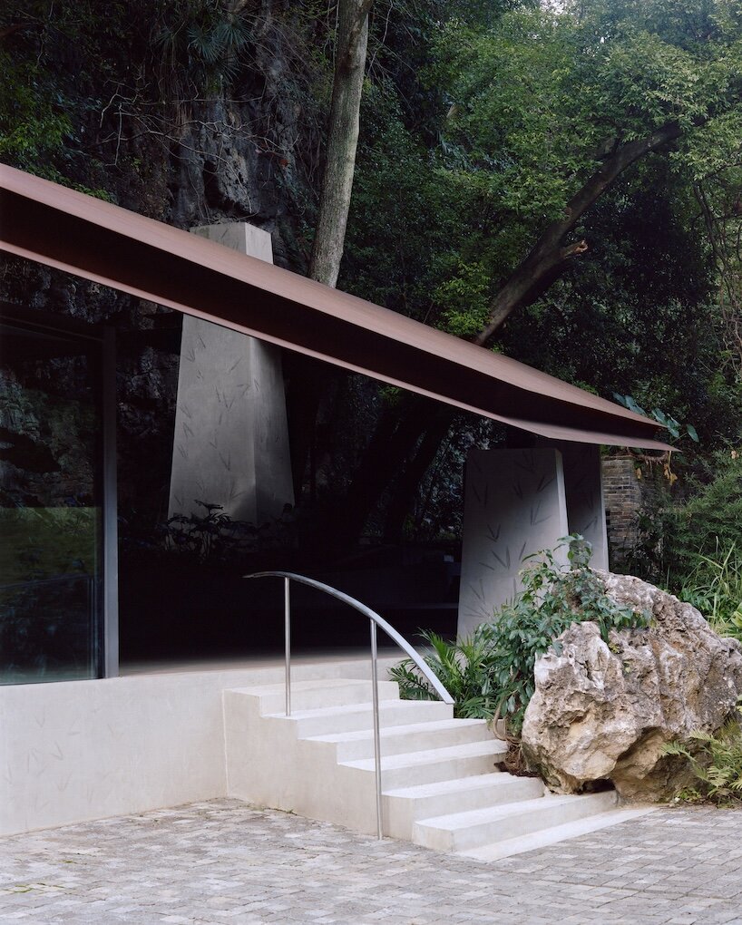 atelier guo frames yangshuo’s mountain landscape beneath a sweeping roof - 8