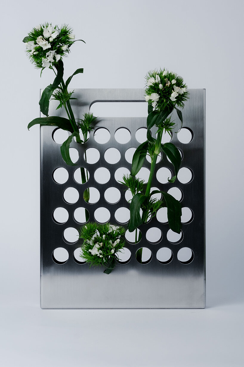 ole müller gives flowers room to spread with bag-like stainless steel vase - 1