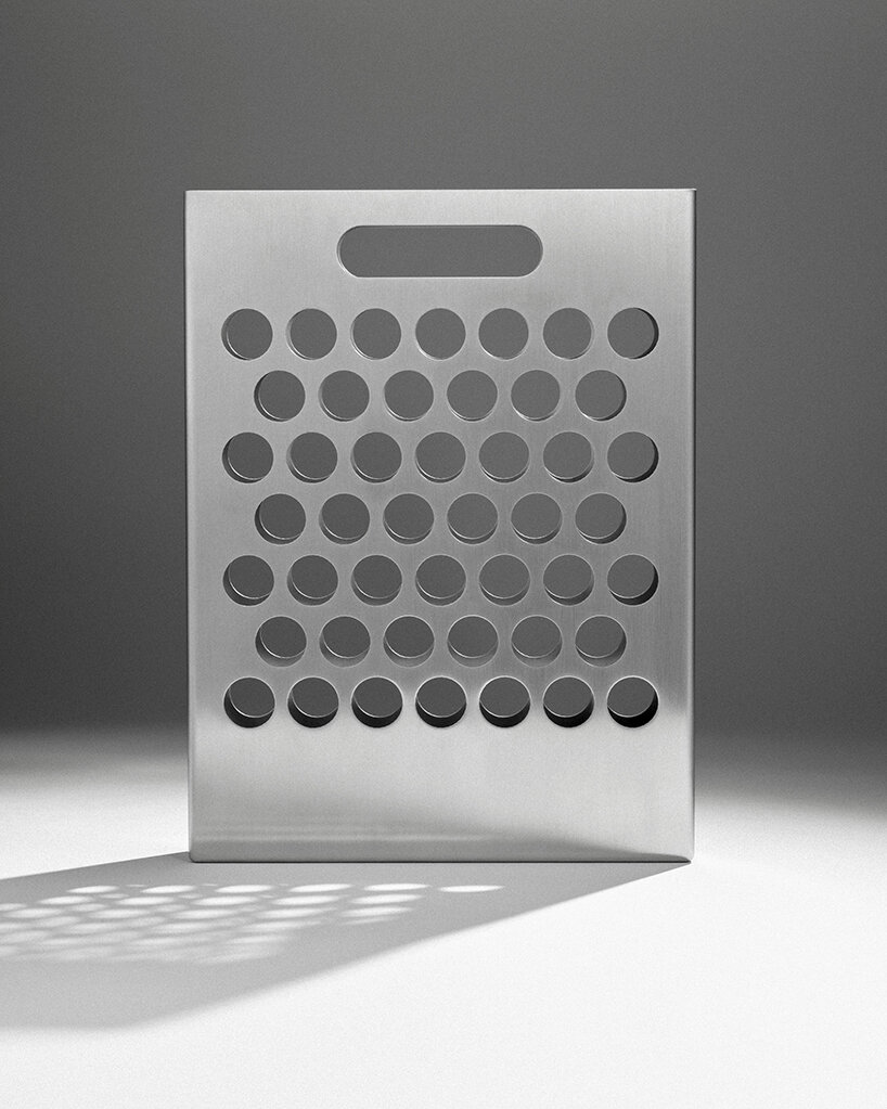 ole müller gives flowers room to spread with bag-like stainless steel vase - 7