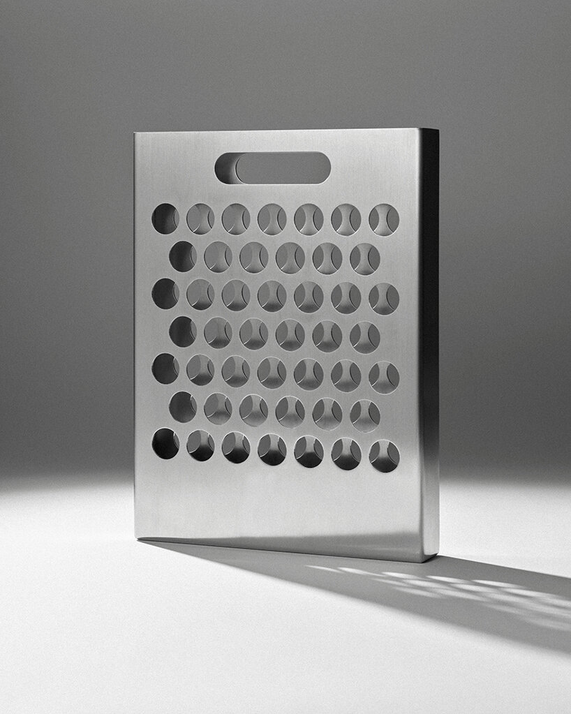 ole müller gives flowers room to spread with bag-like stainless steel vase - 9