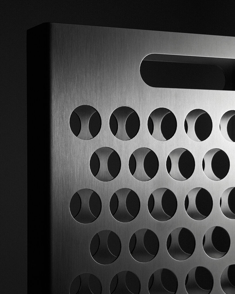 ole müller gives flowers room to spread with bag-like stainless steel vase - 10