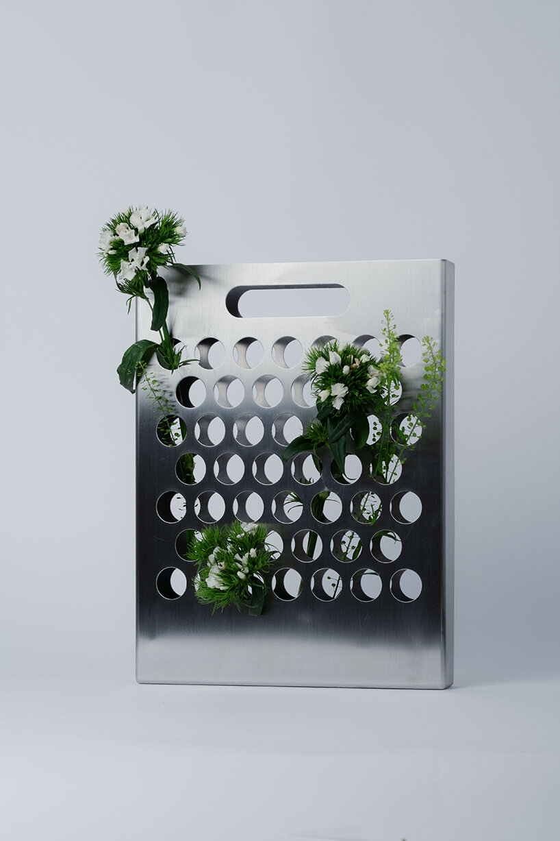 ole müller gives flowers room to spread with bag-like stainless steel vase - 4