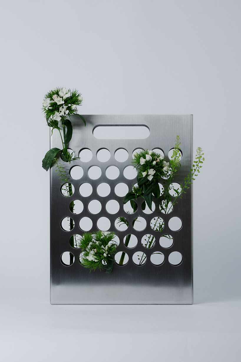 ole müller gives flowers room to spread with bag-like stainless steel vase - 2
