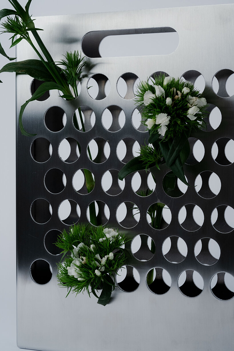 ole müller gives flowers room to spread with bag-like stainless steel vase - 6