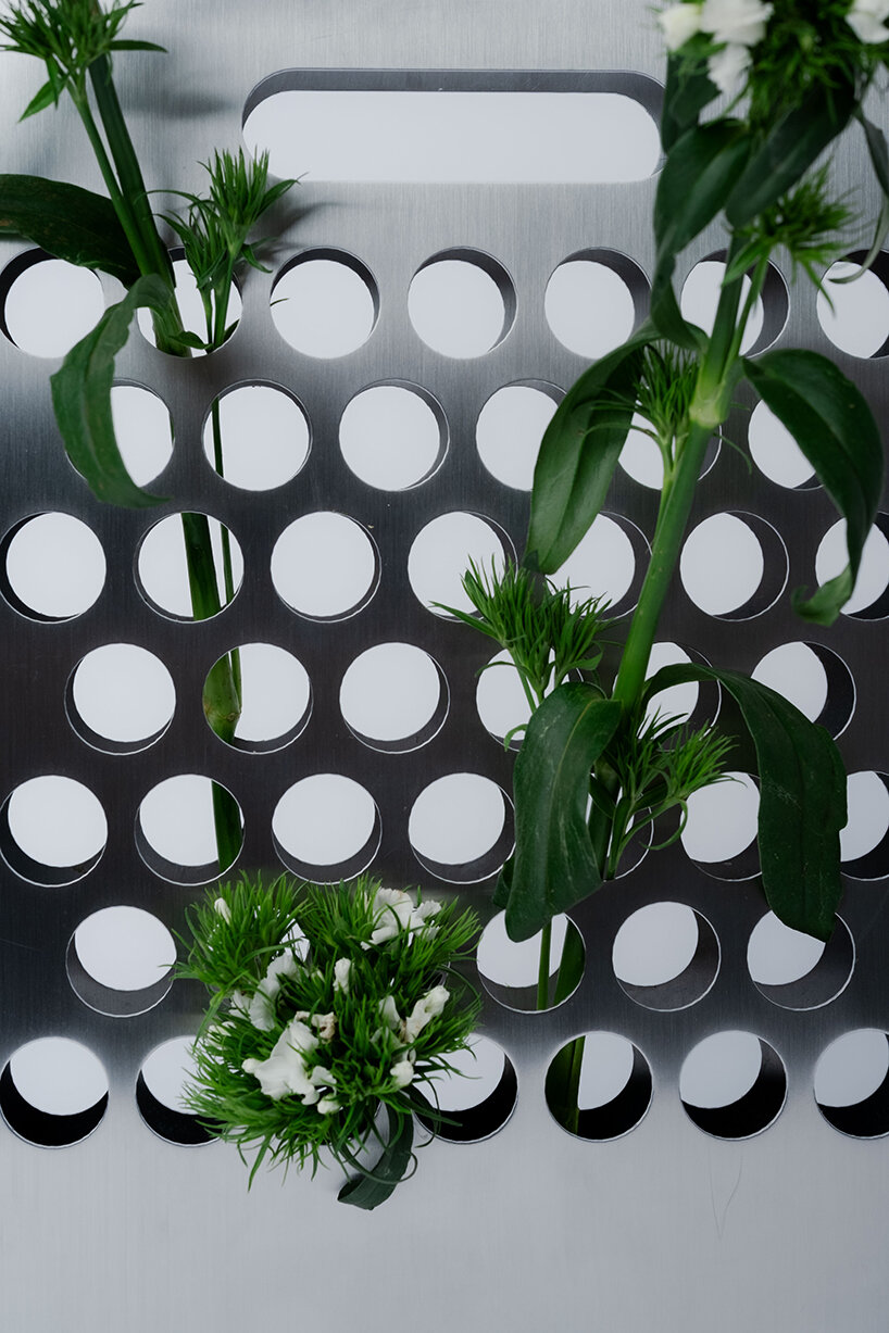 ole müller gives flowers room to spread with bag-like stainless steel vase - 5
