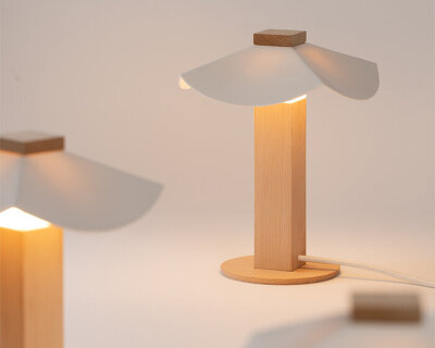 byunggwon na’s ALIT lamp balances ceramic, wood and light in one quiet composition