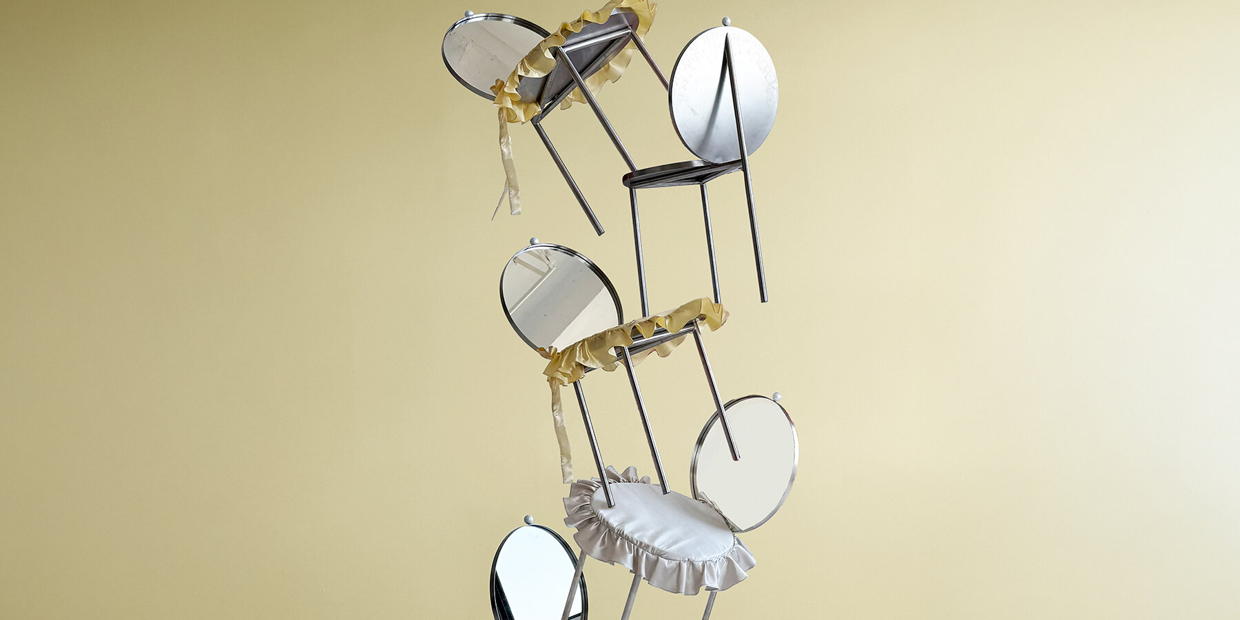 deliberately-uncomfortable-stainless-steel-chair-sitting-social-commentary