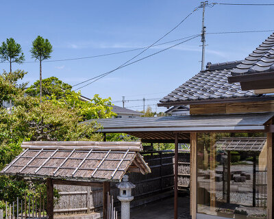 six-tatami garden tea room layers salvaged timber, titanium, and steel in ichihara, japan