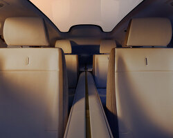 jaguar reveals type 01 interior with full-length 'spine' and travertine tones