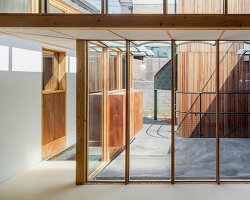 1968 seoul residence is reshaped with courtyard, annex and timber frame