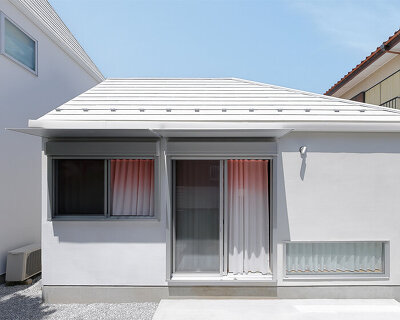 shifted roofs and reflected light connect old and new homes in suburban tokyo