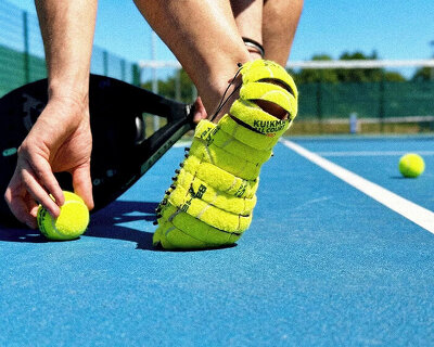 sliced open and rebuilt, discarded tennis balls become wearable shoes