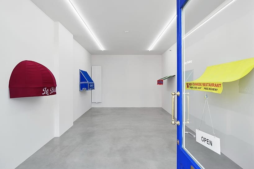 storefront canopies leave the streets behind to become sculptures of urban identity - 1