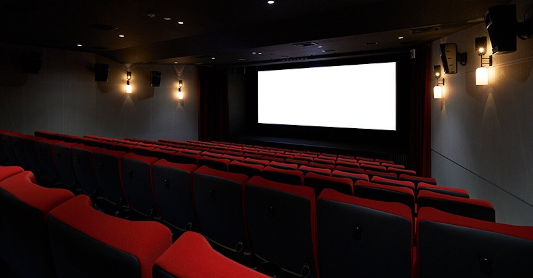 tato architects turns a former bank into a reflective cinema in kyoto