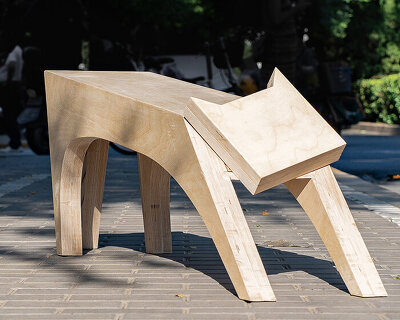 traditional potter’s stand becomes a timber bench shaped like a stretching cat