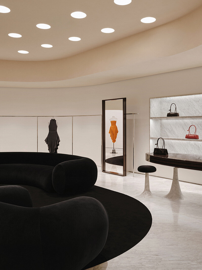 alaïa reopens shanghai boutique with perforated facade and curved interior - 4