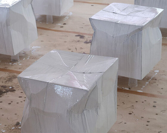 illya goldman gubin embraces cardboard boxes, shaping them into stools for bottega veneta