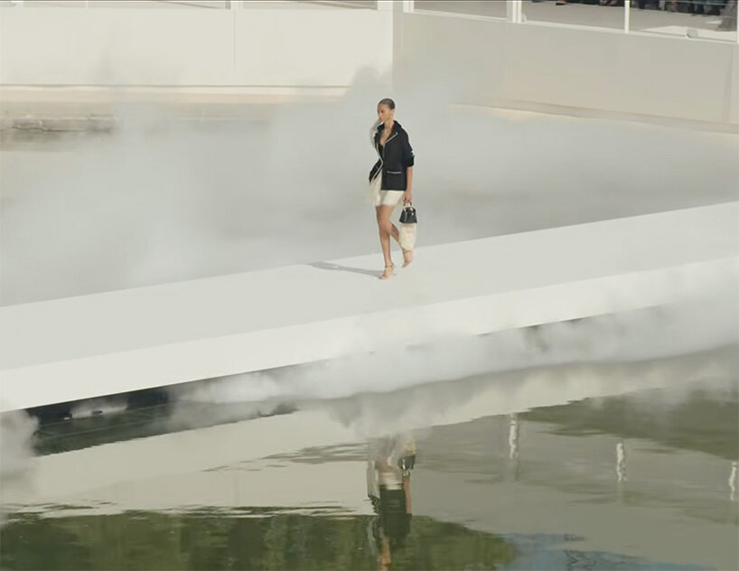 bureau betak places a geometric white runway in a mist-filled landscape for dior - 5