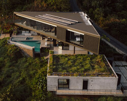 triangular layered residence by QBO3 arquitectos nestles on costa rican hillside