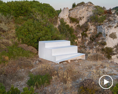 four-level white platform stands as a collective throne at the western edge of greece
